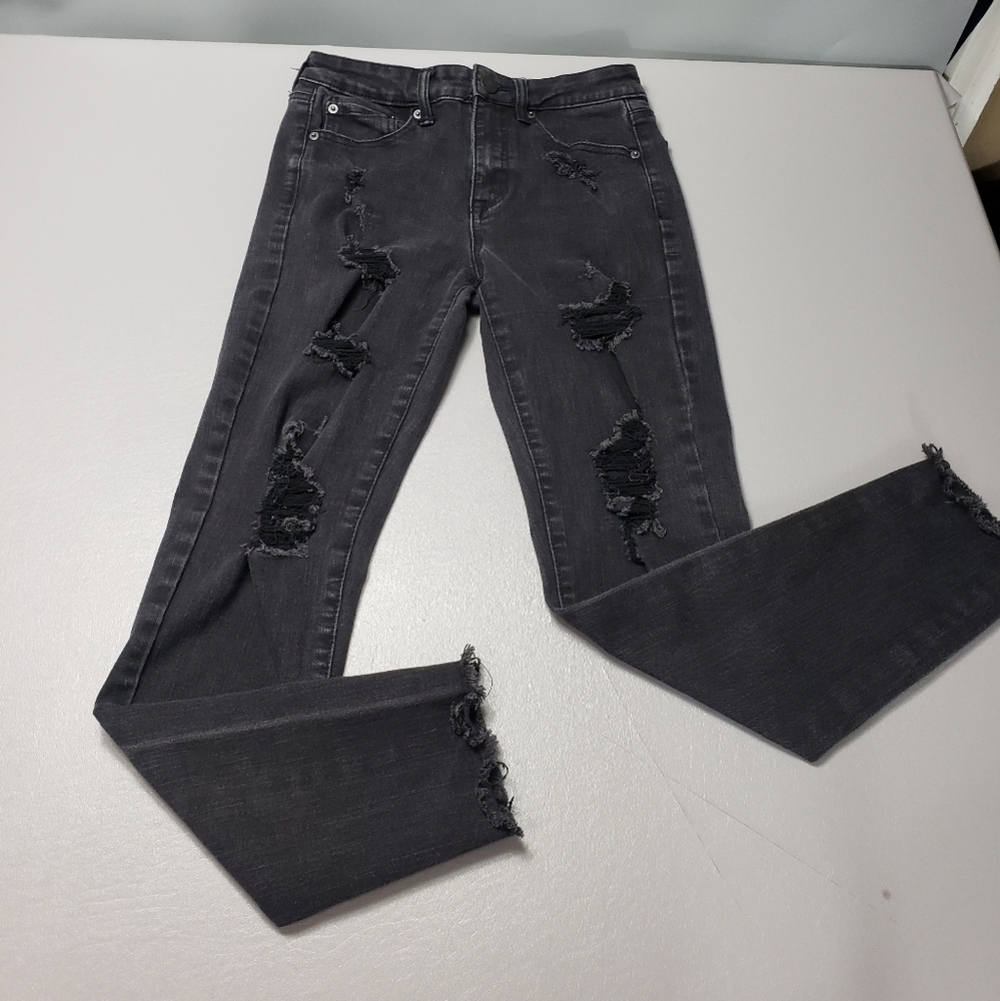 Aero high rise faded black ripped raw hem skinny jeans women's size 4
